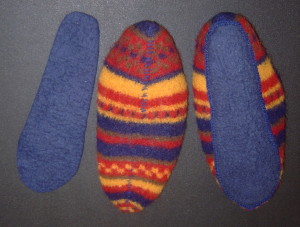 Cut separate felt sole and stitch to slipper